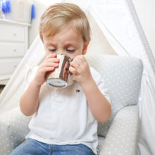 Load image into Gallery viewer, a toddler boy is drinking from a Kiddobloom stainless steel cup 
